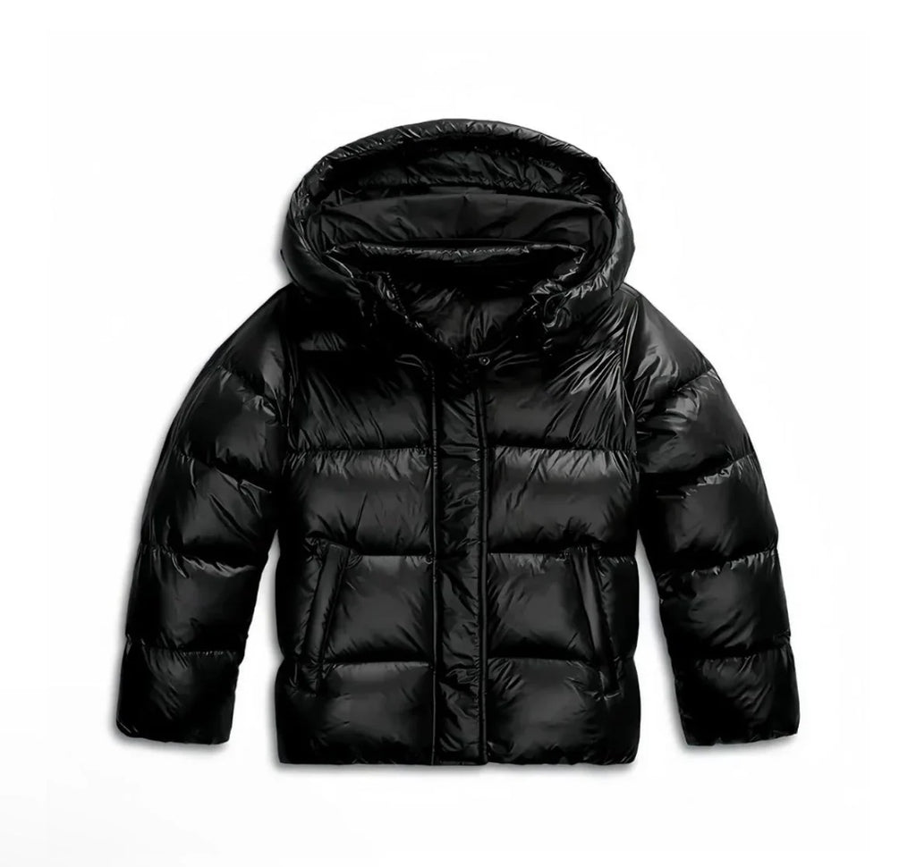 Back view of women's hooded puffer jacket showing cropped length and hood