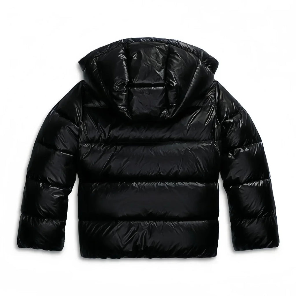 Navy puffer jacket front zip and hood detail on model in studio setting