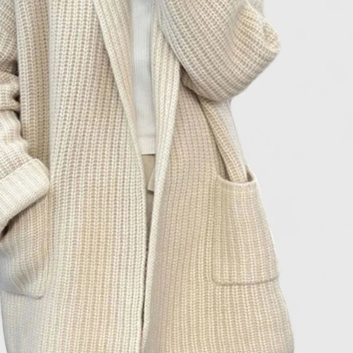 Detail shot of open front cardigan highlighting soft ribbed texture and cosy knit construction in taupe