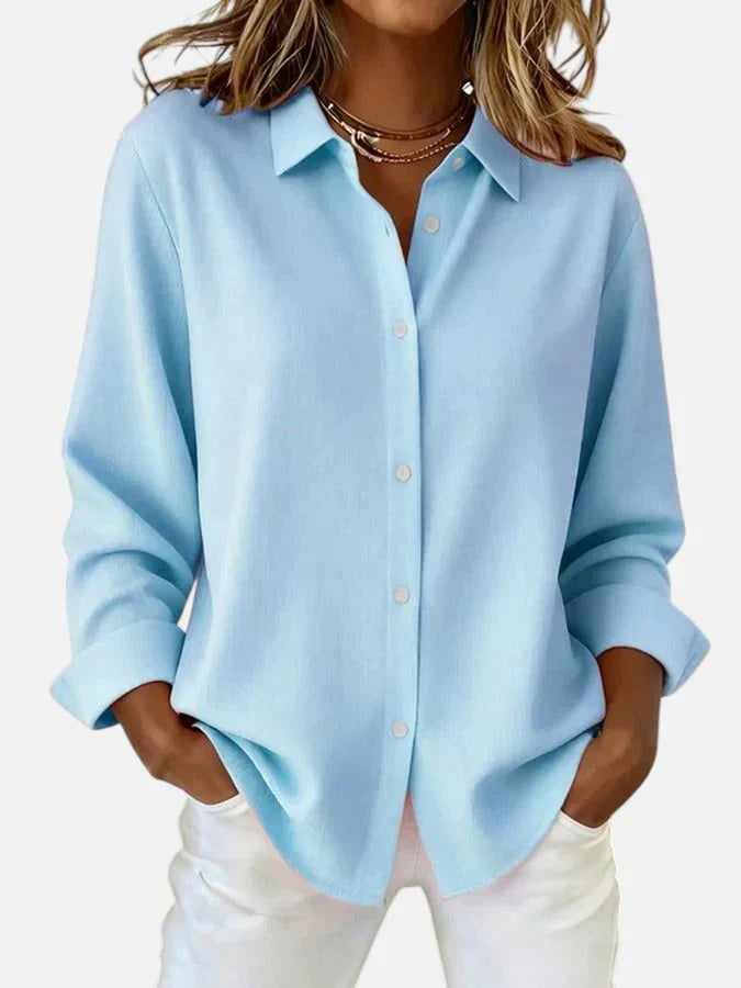 Back view of women's oversized shirt showing roomy silhouette and dropped shoulder seam detail