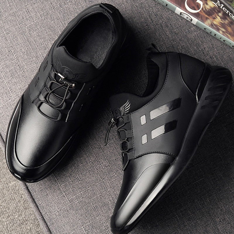 Men's black trainers paired with casual trousers for everyday wear styling