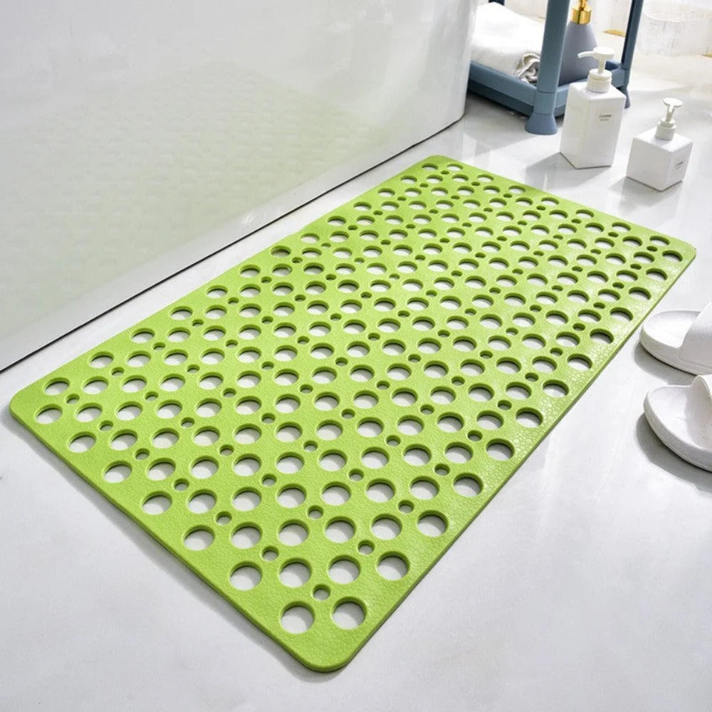 Close-up of perforated shower mat showing drainage pattern and textured surface