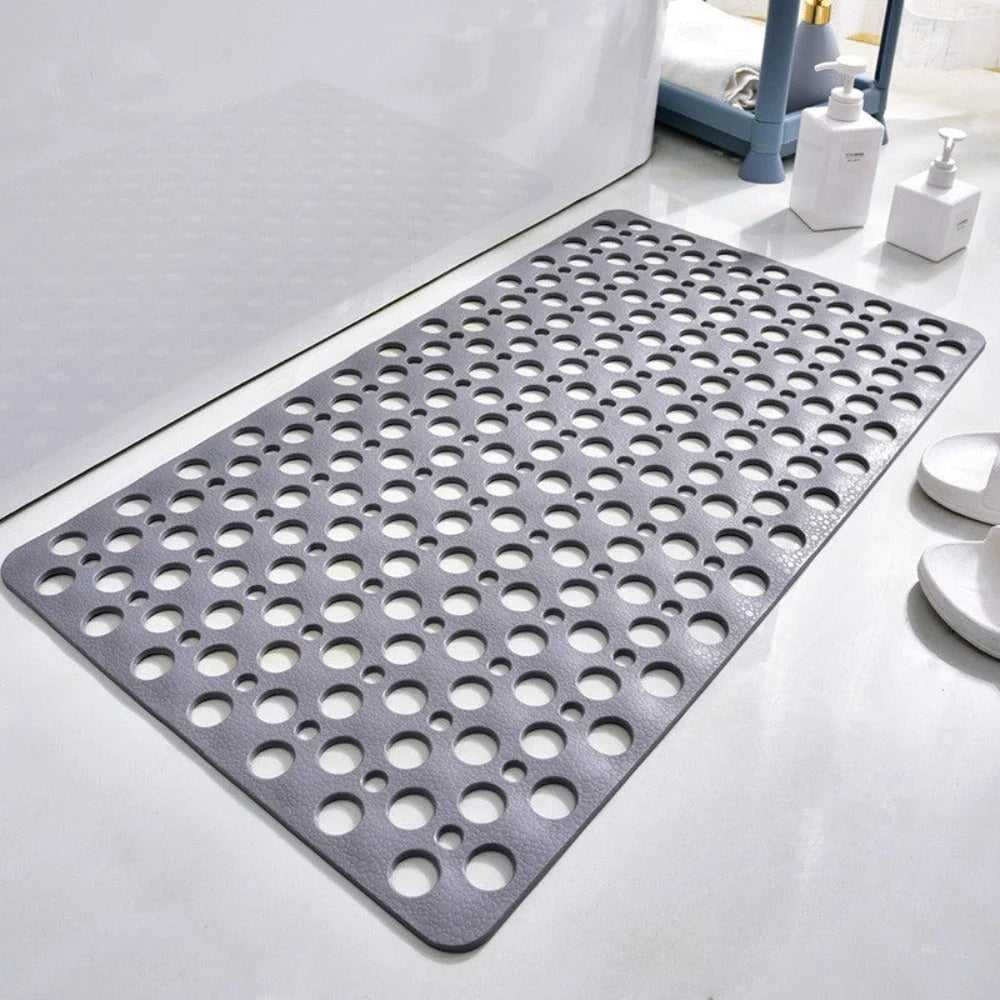 Anti-slip bath mat with suction base positioned in modern bathroom setting