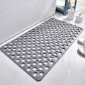 Anti-slip bath mat with suction base positioned in modern bathroom setting