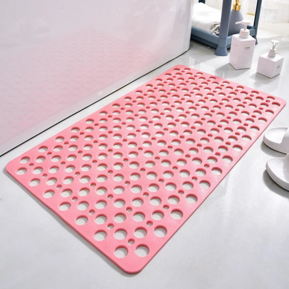 Quick-drain shower mat detail showing circular hole design for water flow