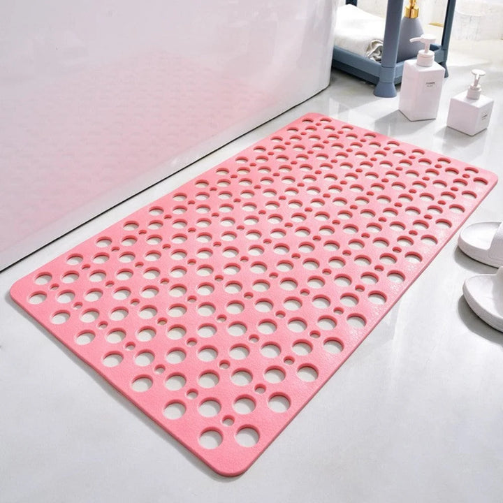 Quick-drain shower mat detail showing circular hole design for water flow