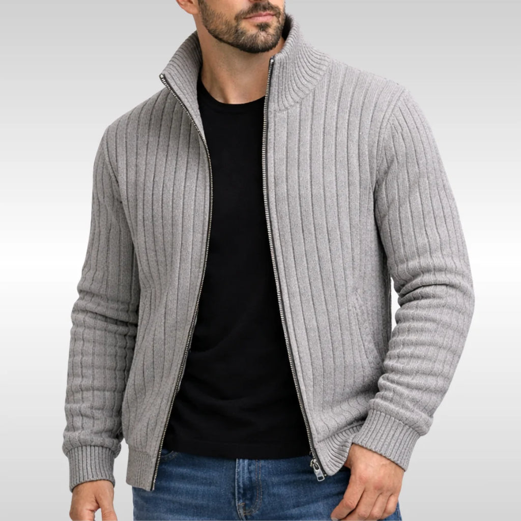 Close-up of ribbed knit texture and zip fastening detail on men's grey cardigan