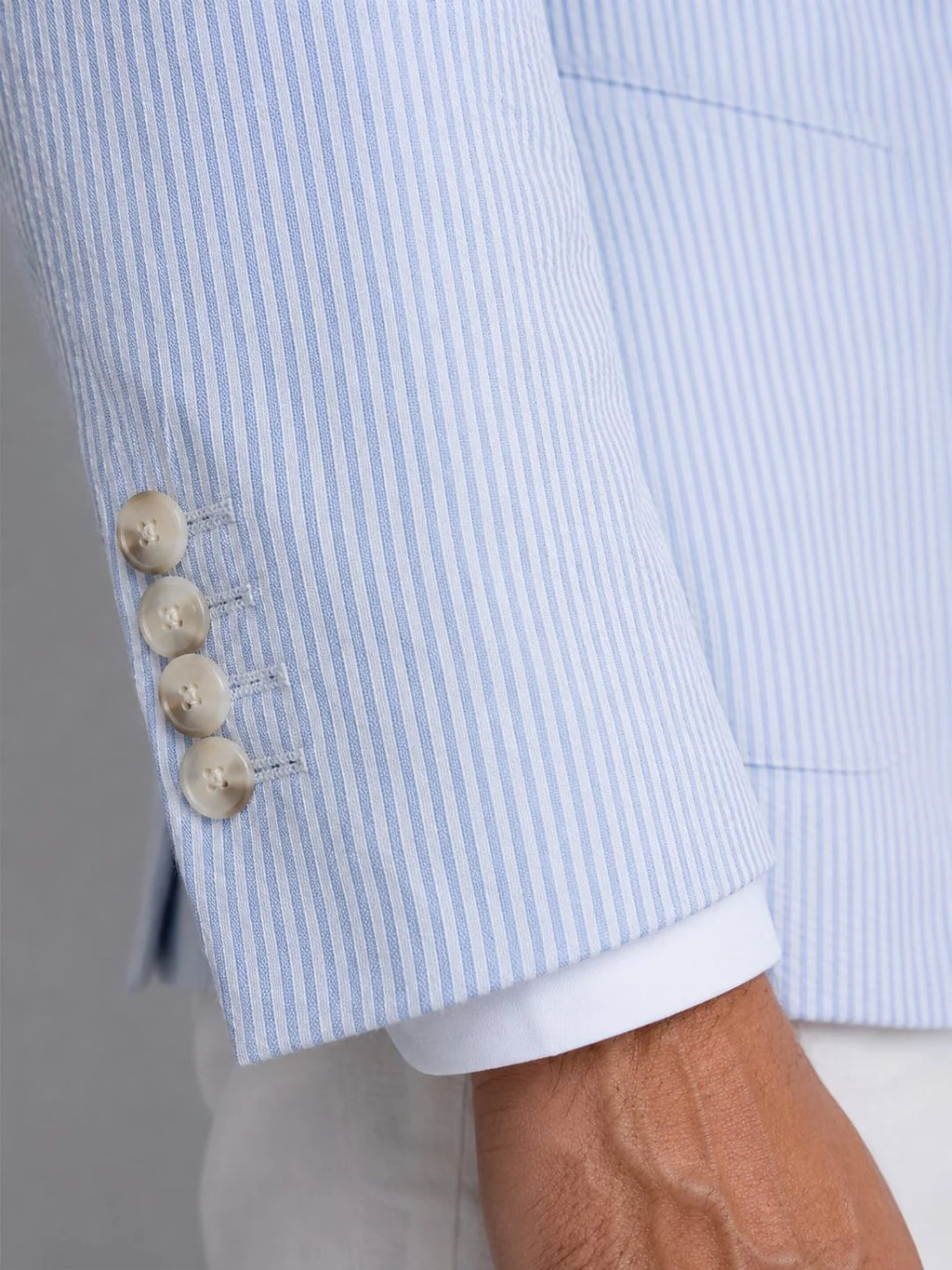 Close-up of textured seersucker weave fabric on men's blazer