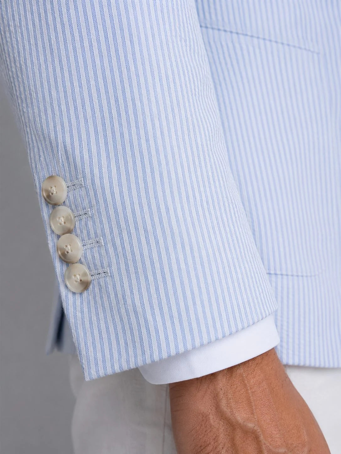 Close-up of textured seersucker weave fabric on men's blazer