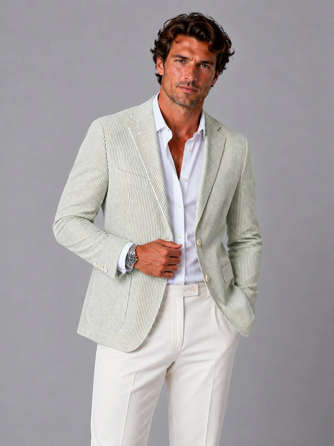 Detail of notch lapel and button closure on men's seersucker blazer