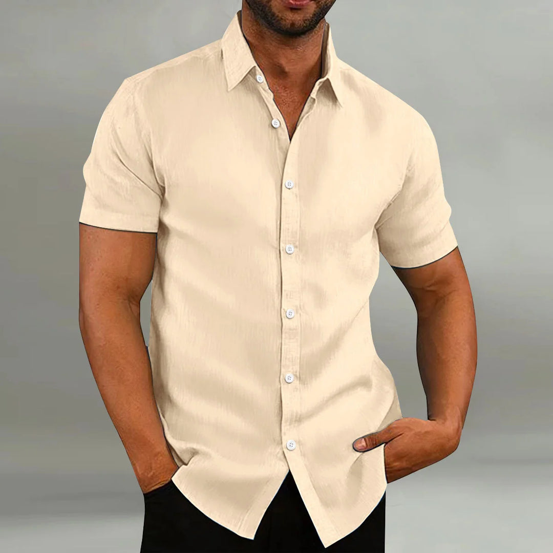 Men's short sleeve shirt detail showing button-through front and smooth fabric drape