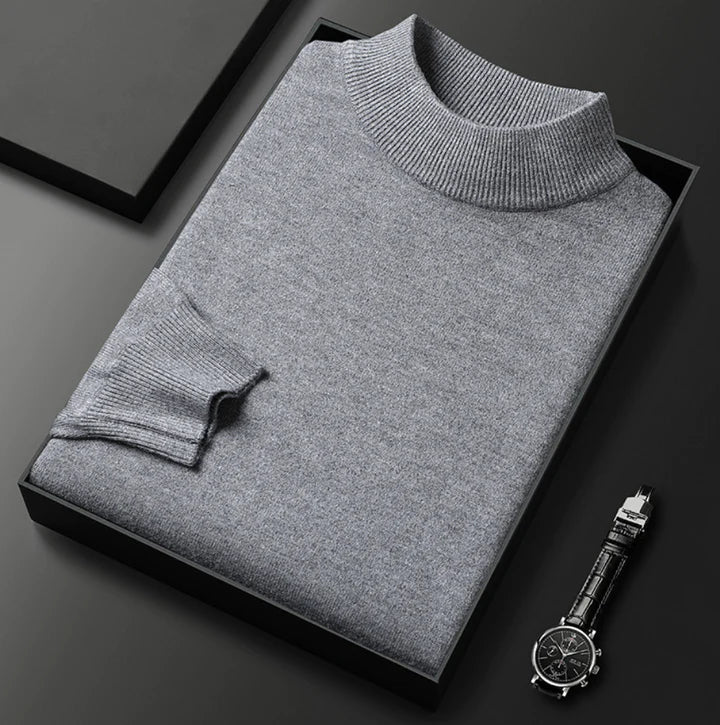 Men's grey turtleneck jumper with ribbed collar and cuffs, folded presentation