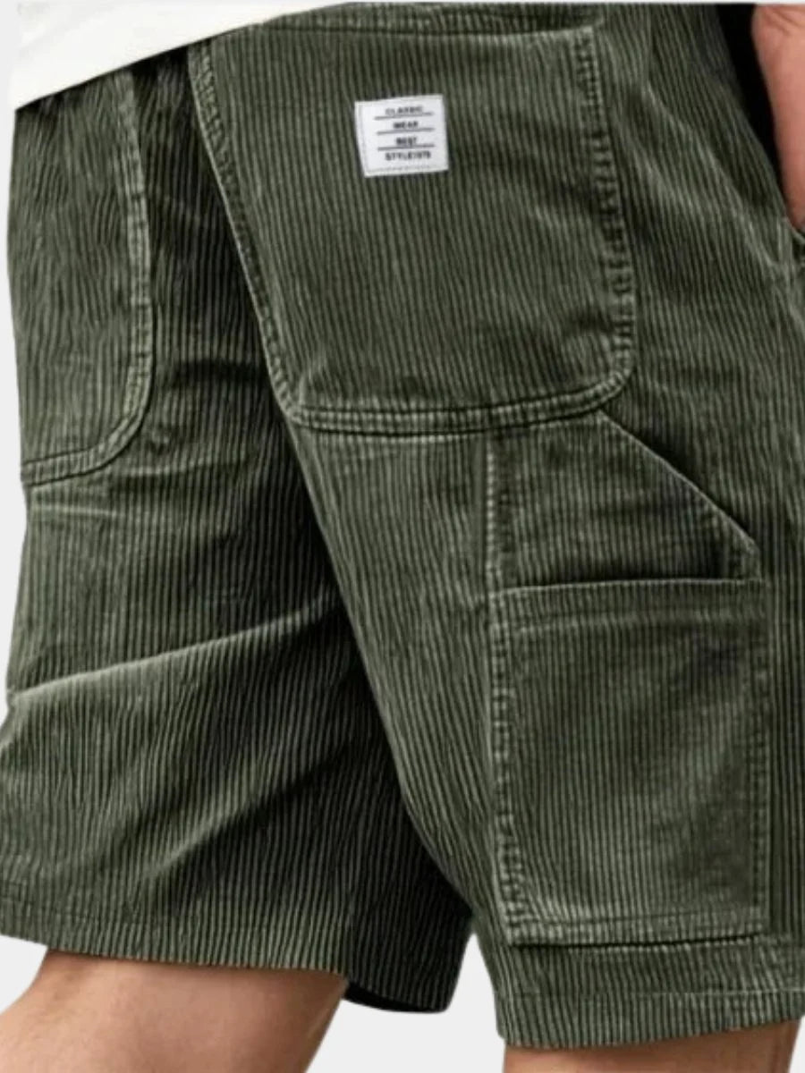Men's corduroy cargo shorts in olive green with ribbed texture and functional cargo pockets