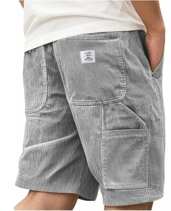 Close-up of ribbed corduroy texture on men's cargo shorts with visible depth