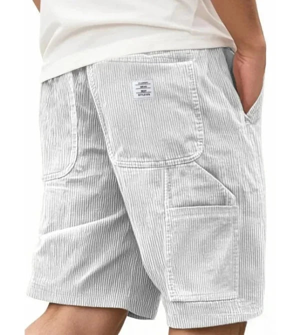 Side angle of men's corduroy cargo shorts showing ribbed fabric and cargo pocket detail