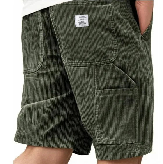 Close-up view of men's corduroy cargo shorts showing ribbed fabric texture and cargo pocket detail