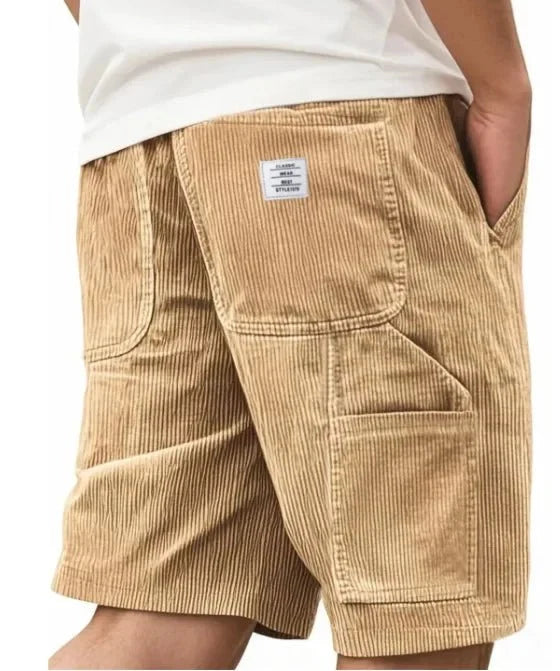 Men's corduroy cargo shorts in olive green with structured fabric and practical storage