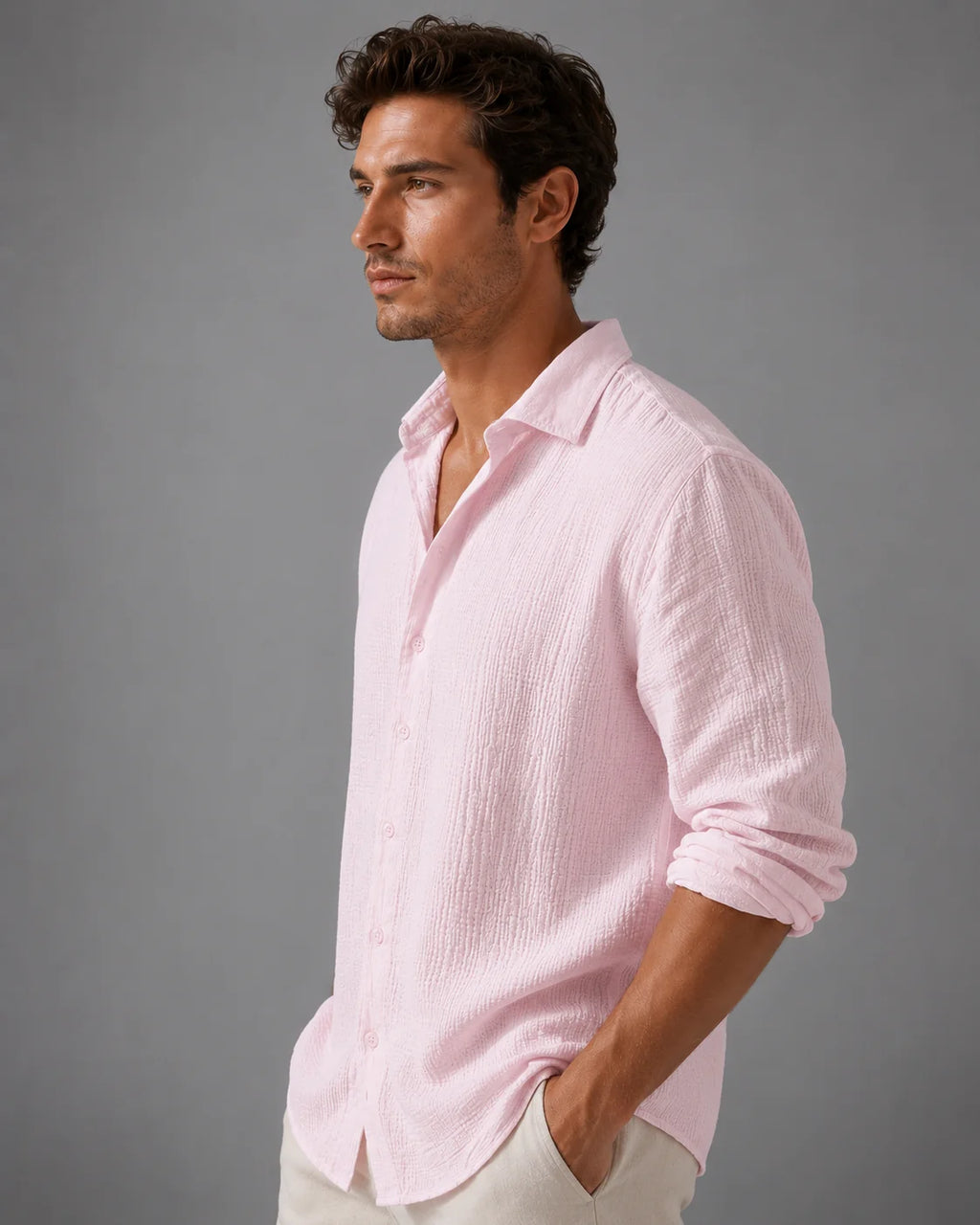 Side angle of relaxed linen shirt with long sleeves and relaxed fit through body