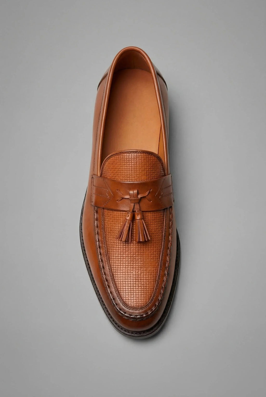 Interior view of men's loafers showing padded insole and slip-on construction