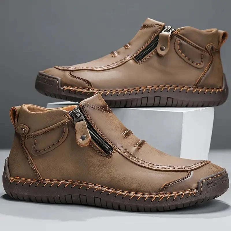 Overhead view of men's ankle boots showcasing streamlined silhouette and zip closure