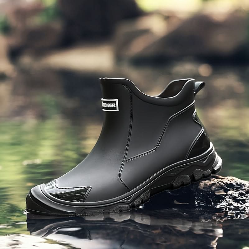 Men's Chelsea boots displayed outdoors showing water-resistant finish and grip sole