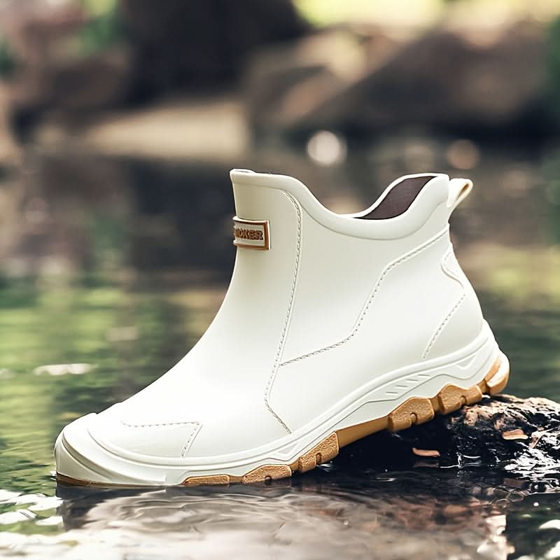 Detail of men's slip-on boots with contrast stitching and structured ankle