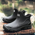 Men's Chelsea boots on stone surface highlighting chunky tread pattern