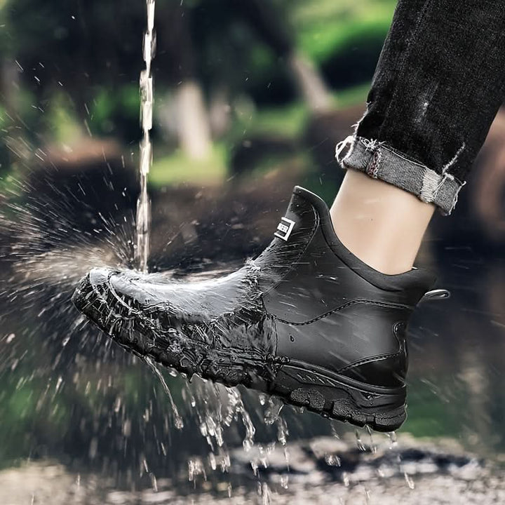 Men's Chelsea boots in outdoor setting with elasticated side panels visible
