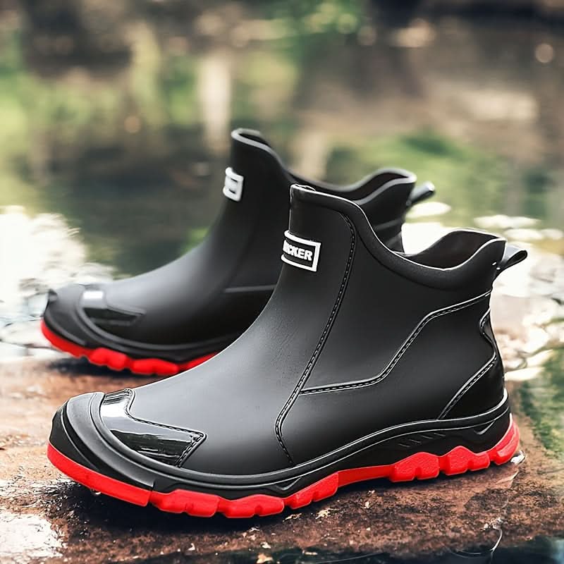 Close-up of textured sole on men's Chelsea boots with red accent