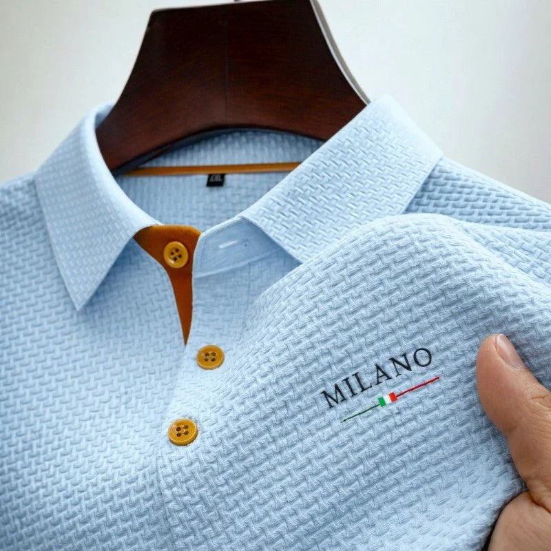 Close-up view of men's textured polo shirt showing woven basketweave fabric pattern and structured collar detail