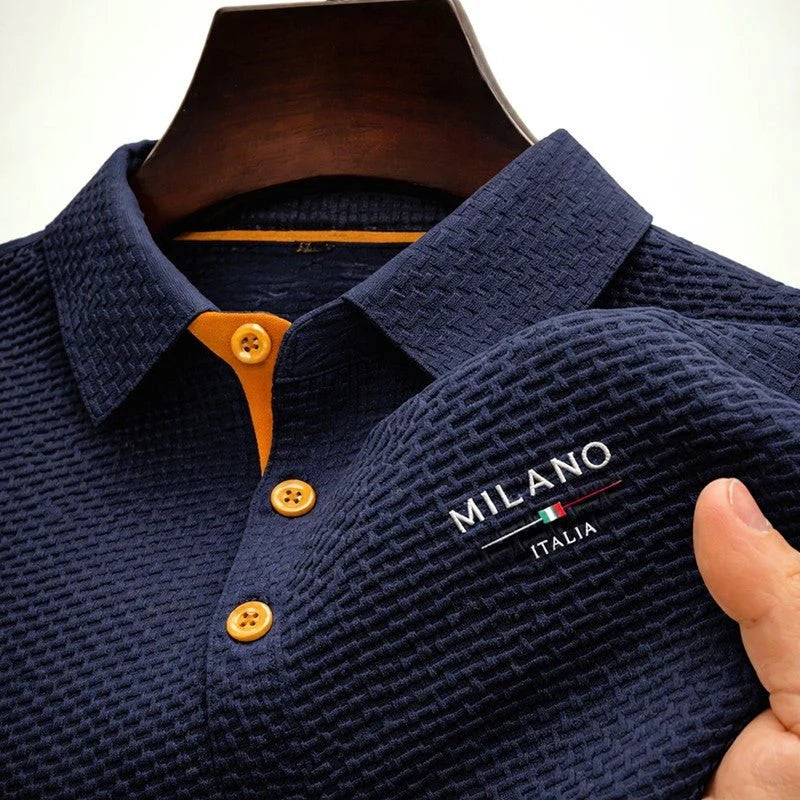 Men's textured polo shirt displayed on hanger showing overall fit and woven fabric texture