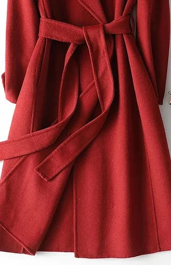 Women's wrap coat with tie belt detail and knee-length cut for layering