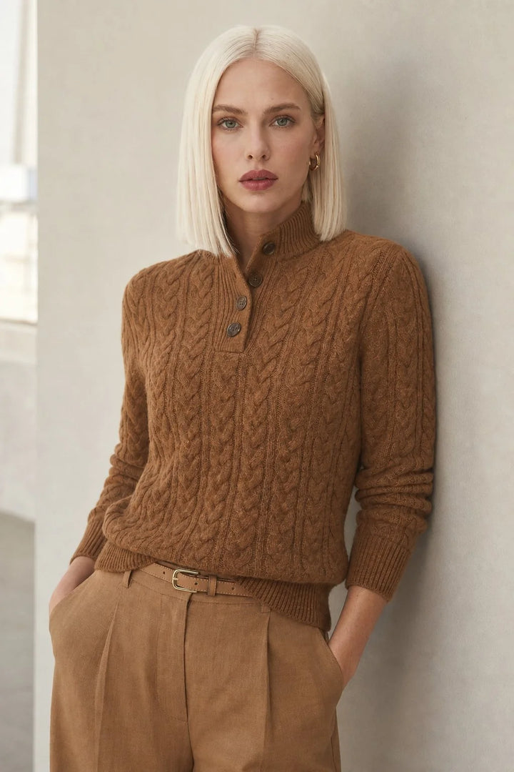 Women's cashmere cardigan in camel with cable-knit texture and button-up stand collar worn with tailored trousers
