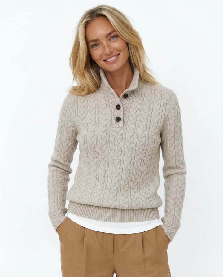 Close-up of cable-knit pattern on khaki cashmere cardigan showing texture detail