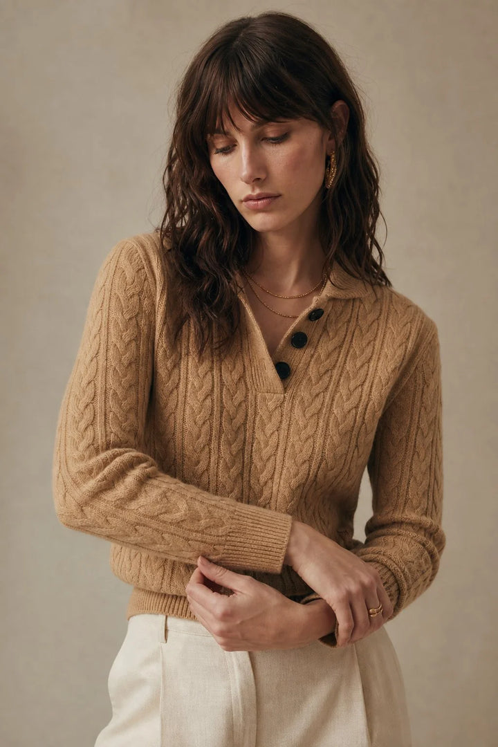 Women's cashmere cardigan styled for autumn layering with neutral tailored separates