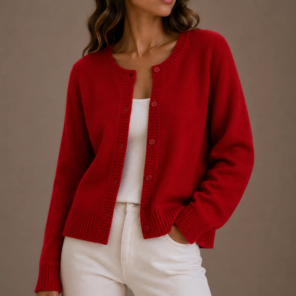 Close-up of women's knit cardigan showing soft fabric texture and button detail