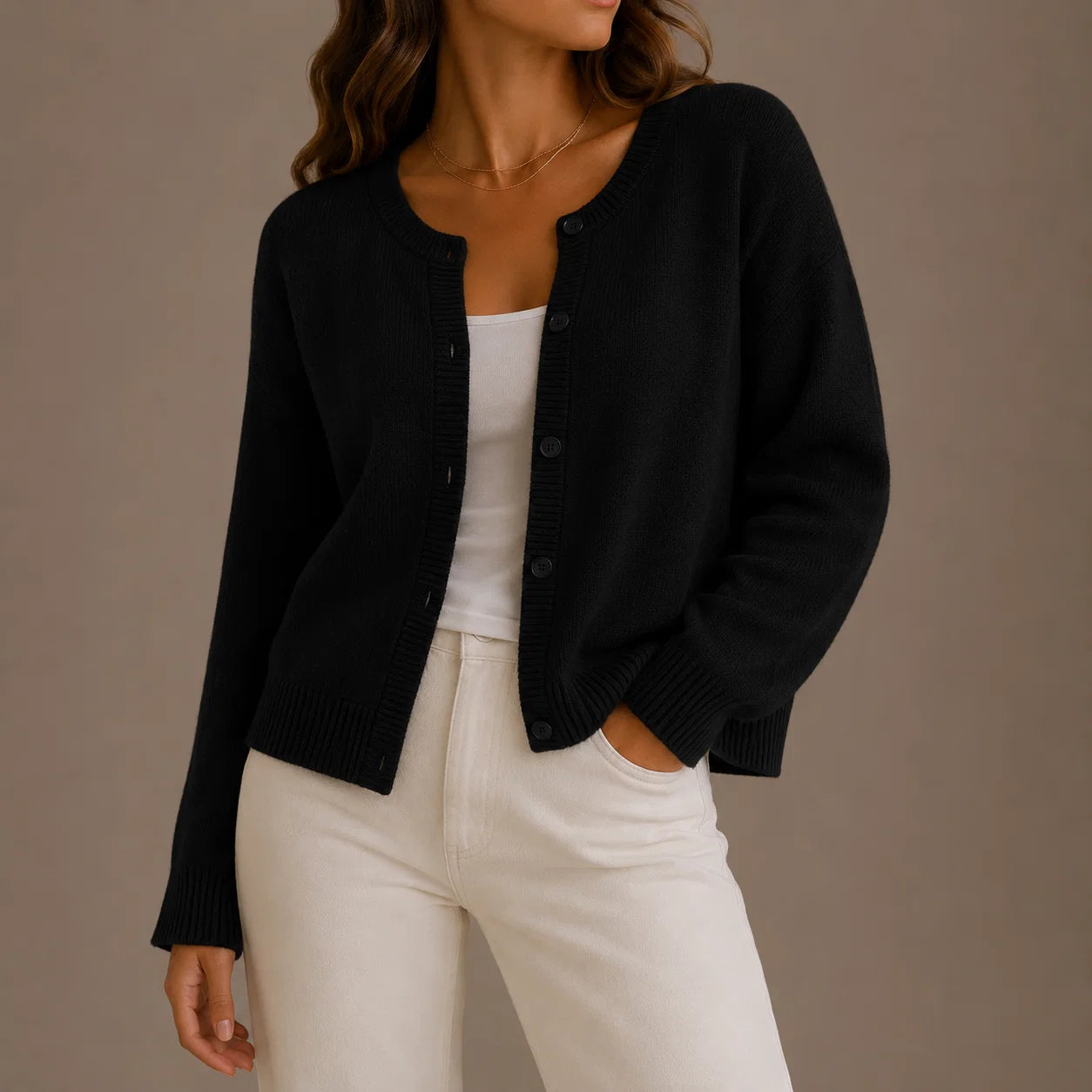 Close-up view of women's knit cardigan showing button-up front and ribbed neckline detail