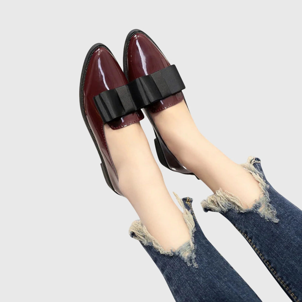 Women's burgundy patent loafers from multiple angles showing pointed toe and flat base