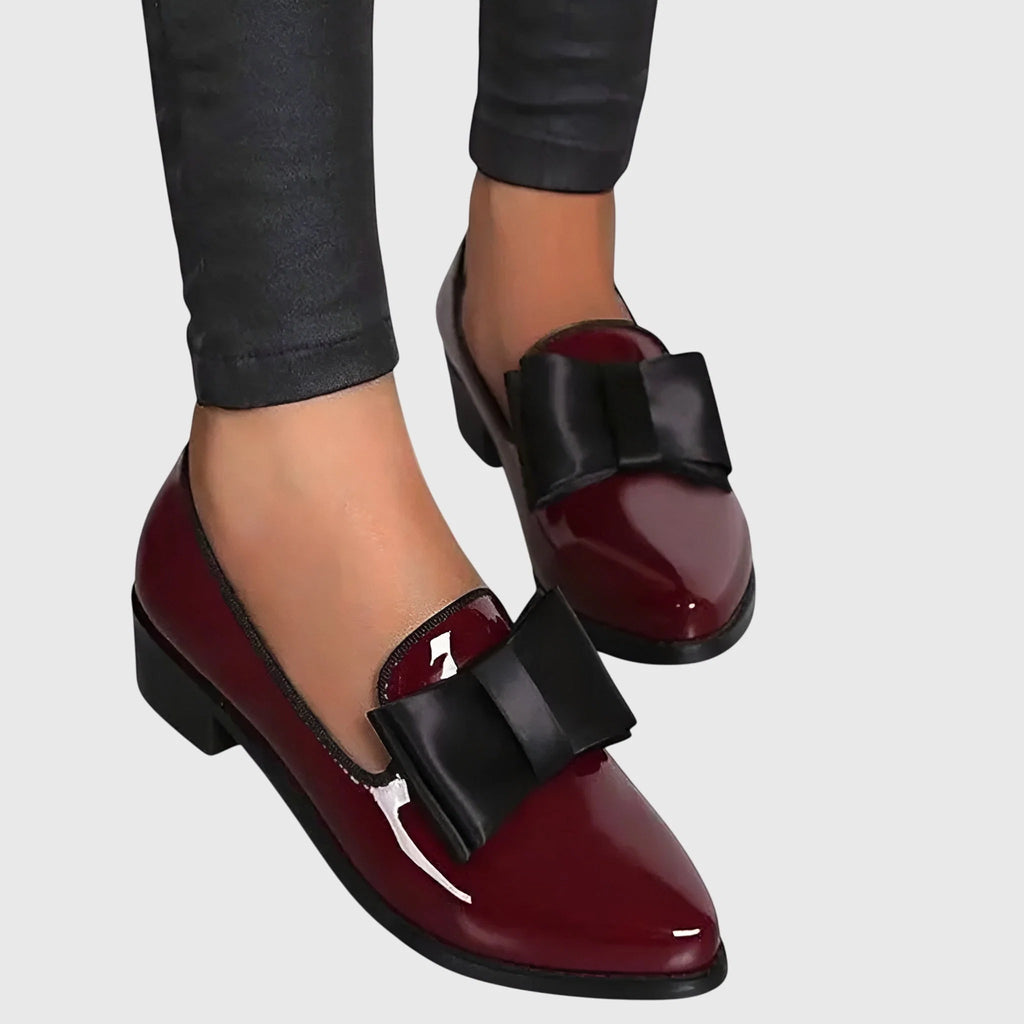 Women's loafers in patent finish with bow detail styled for office or casual wear