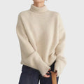 Women's turtleneck jumper in beige with relaxed fit and extended ribbed cuffs for autumn layering