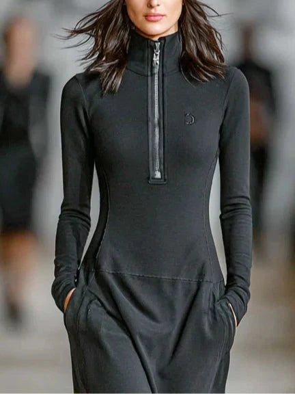Close-up of zip-up track maxi dress showing high neck detail and thumb hole sleeves