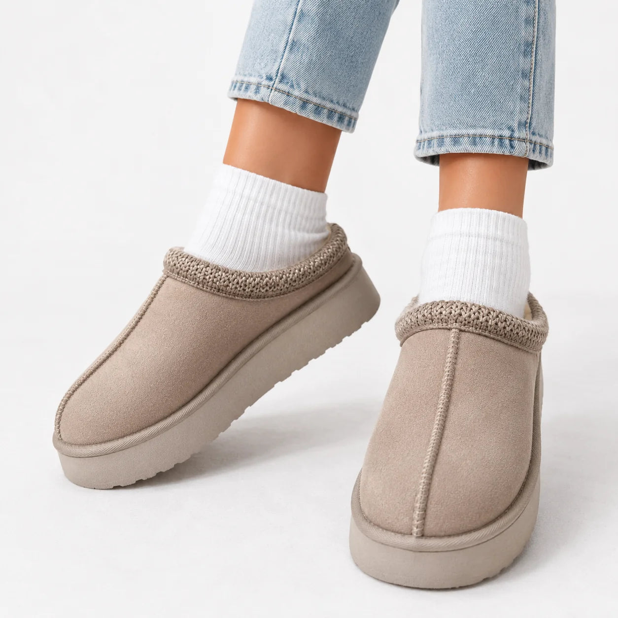 Side view of women's faux suede slip-on slippers with cushioned sole and pull tab