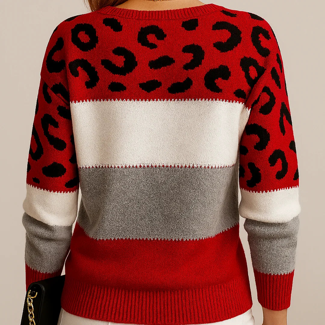 Women's leopard print jumper styled with white jeans and gold jewellery for casual wear