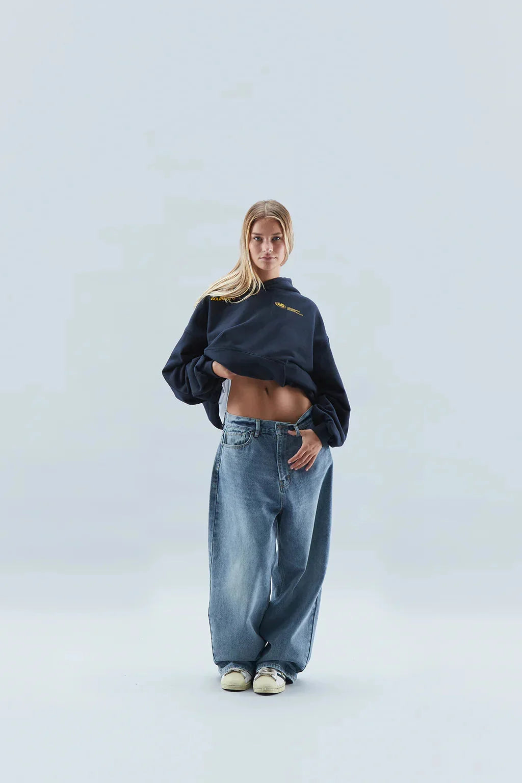 Women's oversized hoodie folded to show fleece-backed fabric construction