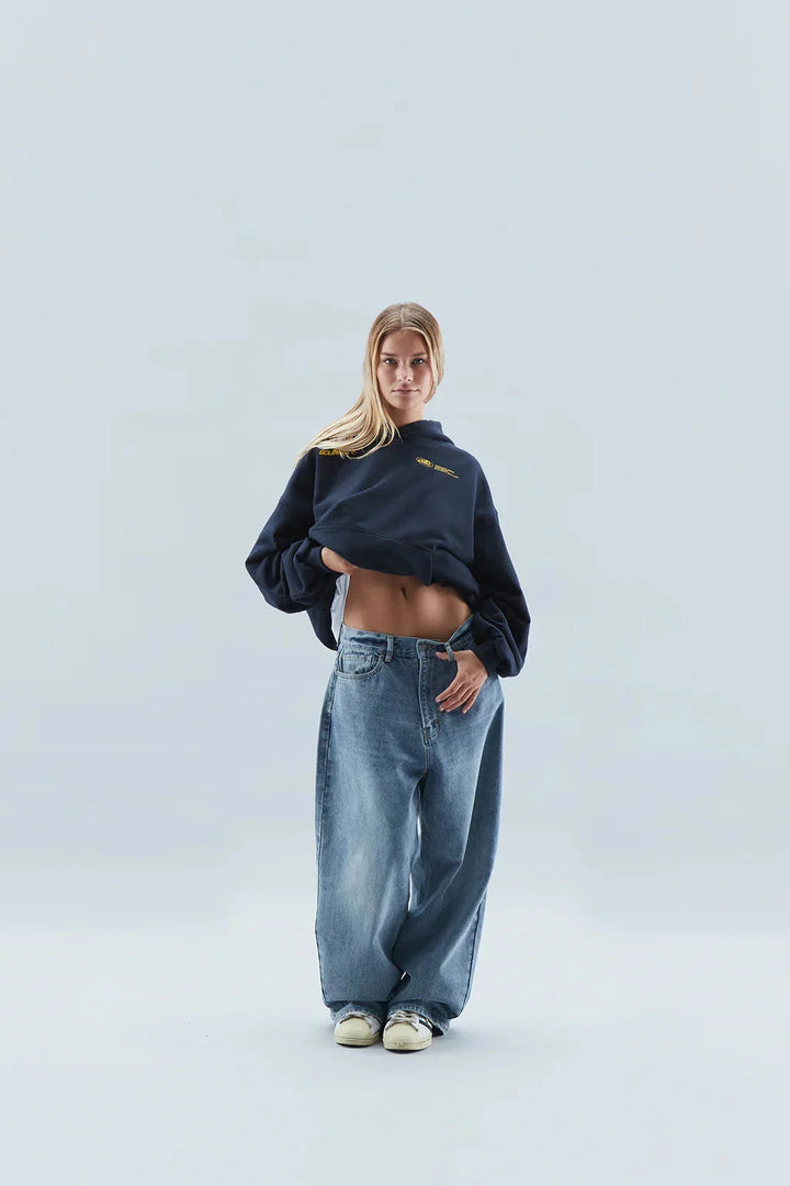 Women's oversized hoodie folded to show fleece-backed fabric construction