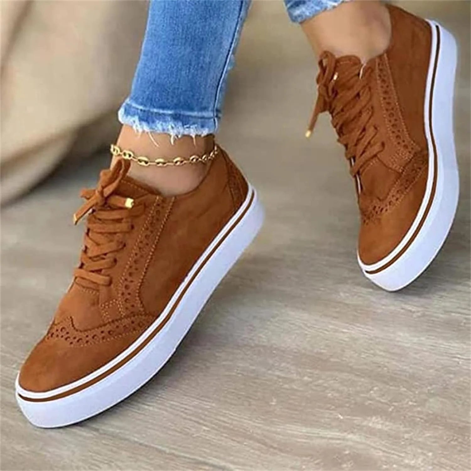 Women's platform trainers with thick white sole and brown upper for everyday styling