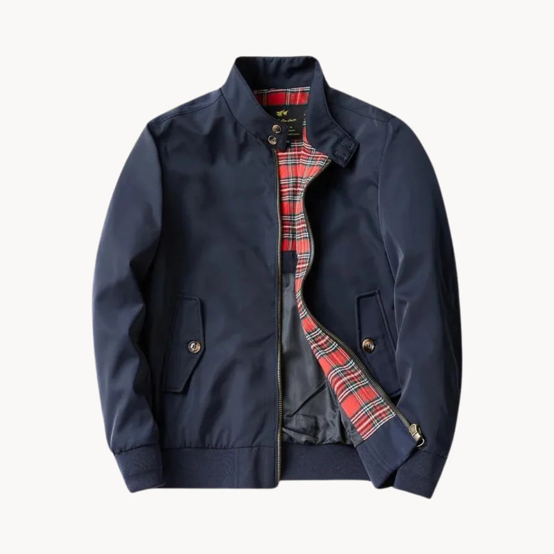 Men's Harrington jacket in navy with tartan lining, zip-through closure, and ribbed cuffs on white background