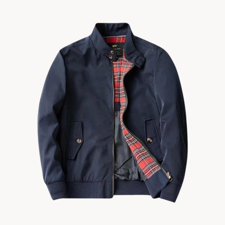 Men's Harrington jacket in navy with tartan lining, zip-through closure, and ribbed cuffs on white background