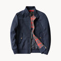 Men's Harrington jacket interior showing red and navy tartan lining and inner pockets