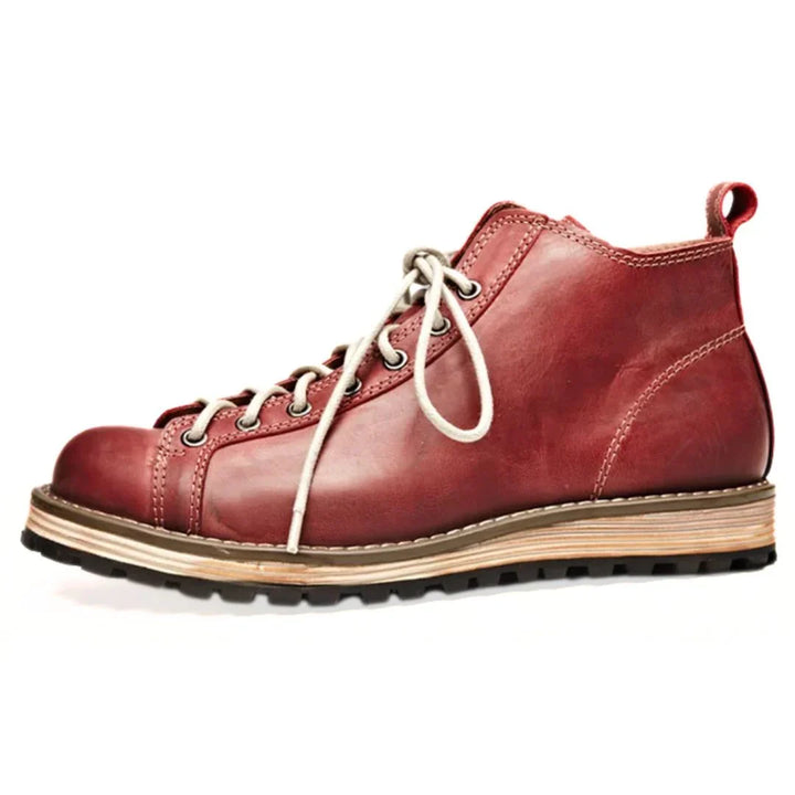 Close-up of lace-up closure and rounded toe box on men's outdoor boots